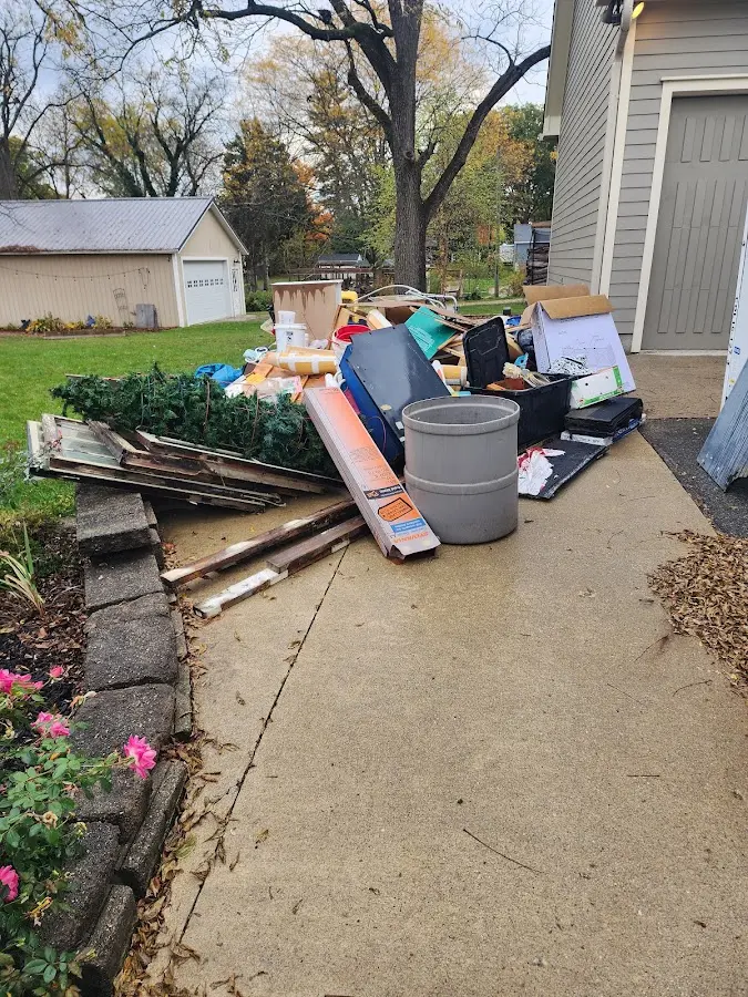 Dumpster being loaded with debris for 30 Yard Dumpster Rental in Newark